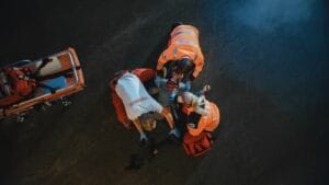 paramedics helping injured person