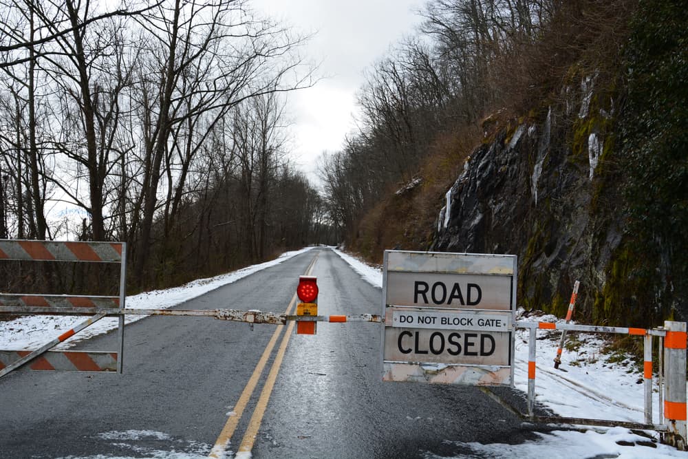 Barricades block access to Blue Ridge Parkway in winter, outside Asheville, NC.